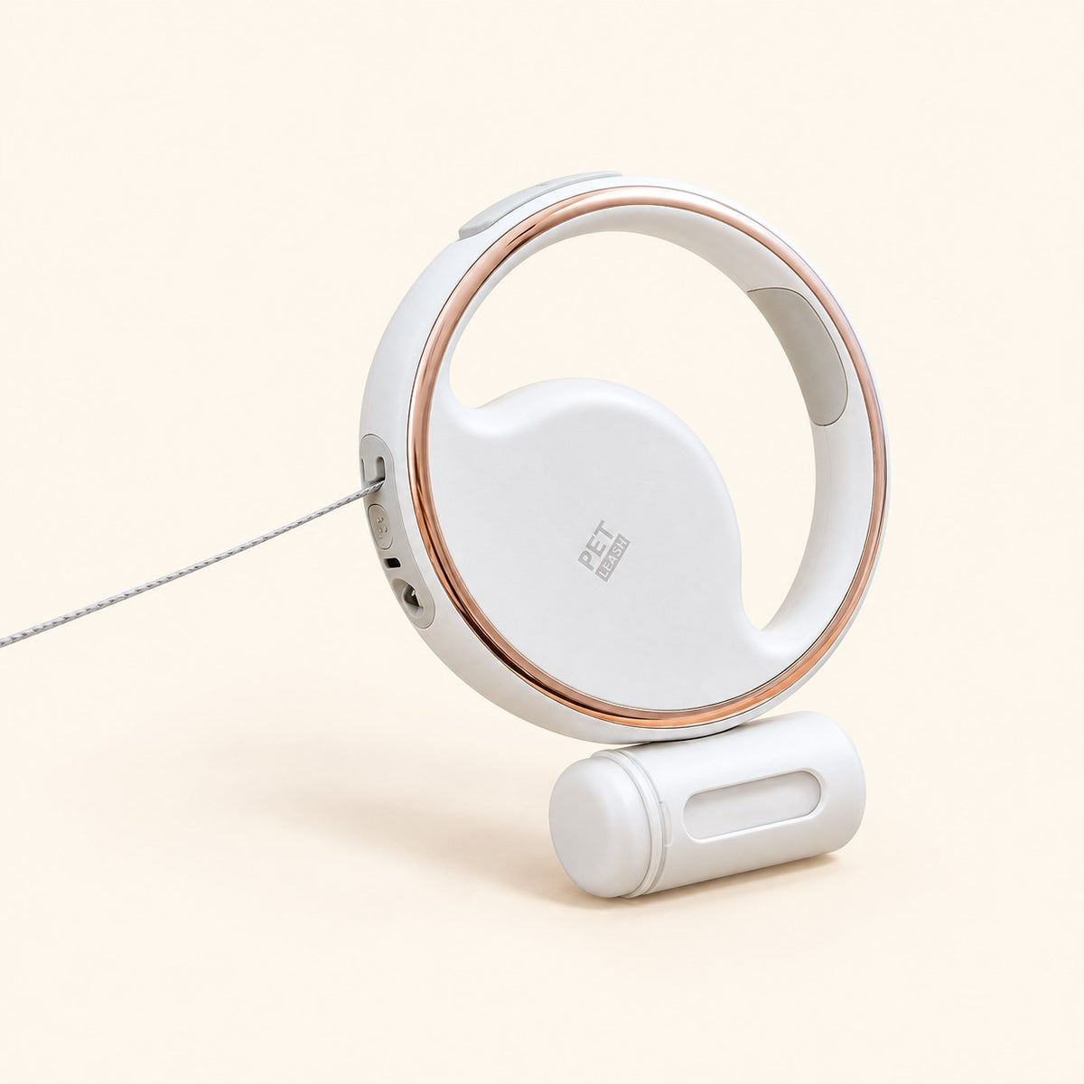 Retractable dog leash with a rose-gold ring and a clip-on poop-bag holder